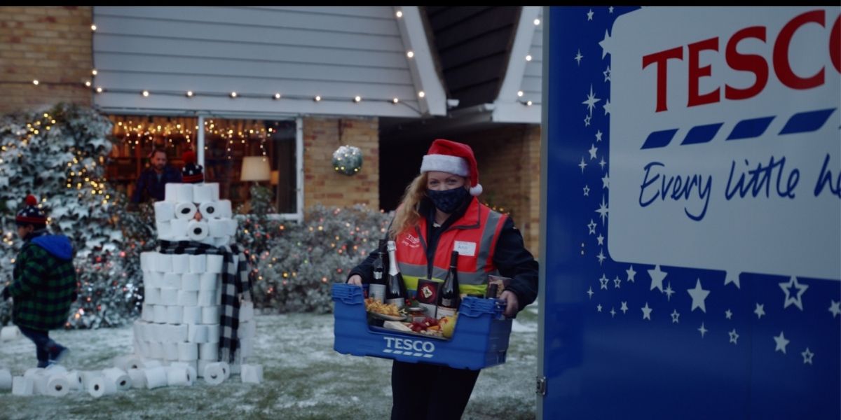 Tesco Christmas Advert Dropping shopping Under The Christmas Tree