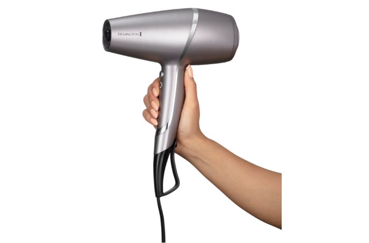 Remington PROluxe You Adaptive Hairdryer in hand