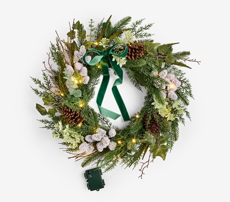 Image of Laura Ashley green pre lit pine christmas wreath with pinecones, floral details and a deep green velvet bow.