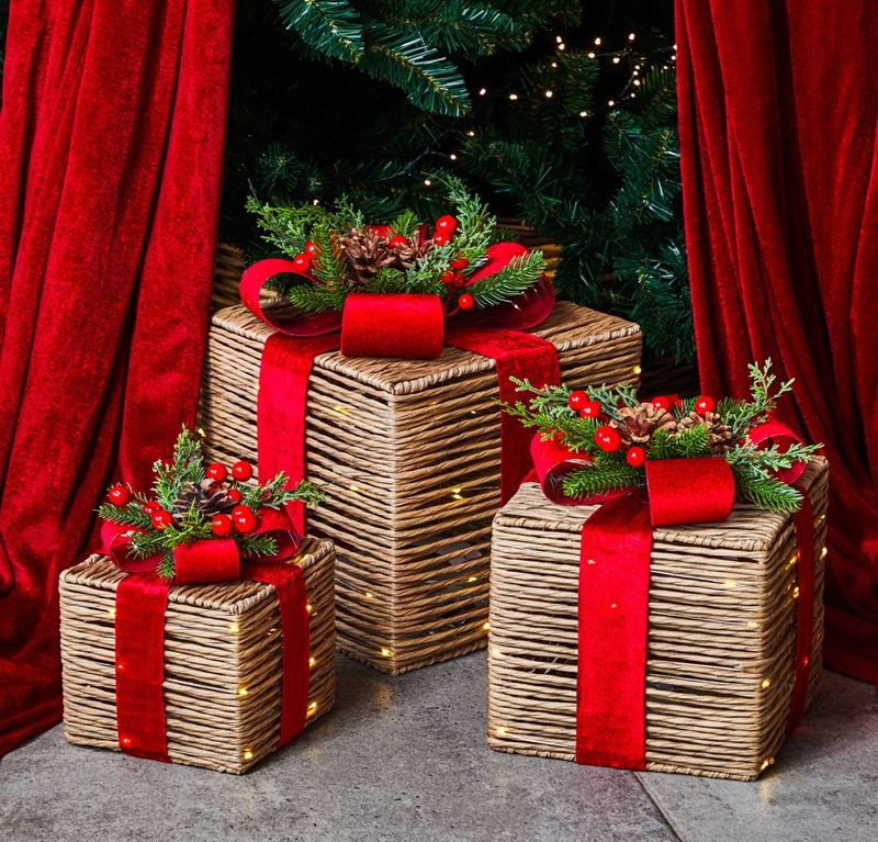 festive-feeling-presents Image of Home Bargains ratten style Christmas presents with red bows and red bows on top.